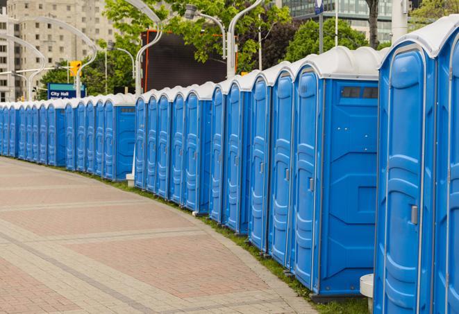 a line of portable restrooms at a sporting event, providing athletes and spectators with clean and accessible facilities in Apollo Beach